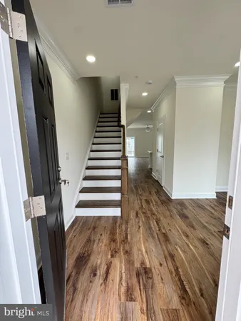 a view of entryway with wooden floor