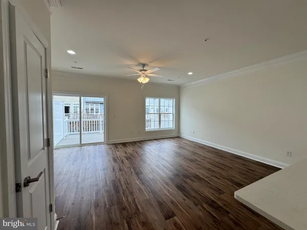 a large kitchen with stainless steel appliances a large counter top