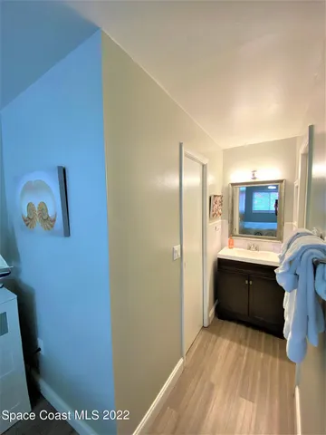 a spacious bathroom with a sink and a mirror