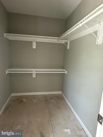 a view of backyard with deck and furniture