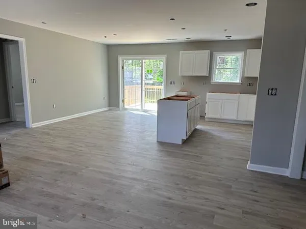 a kitchen that has a sink and a stove top oven