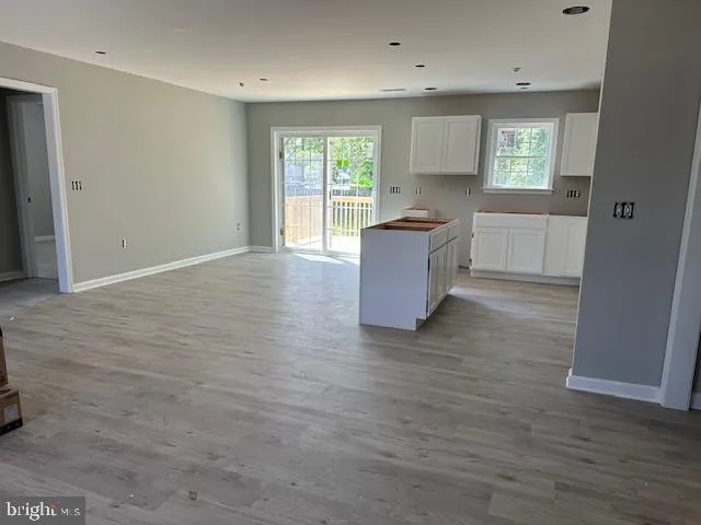 a kitchen that has a sink and a stove top oven