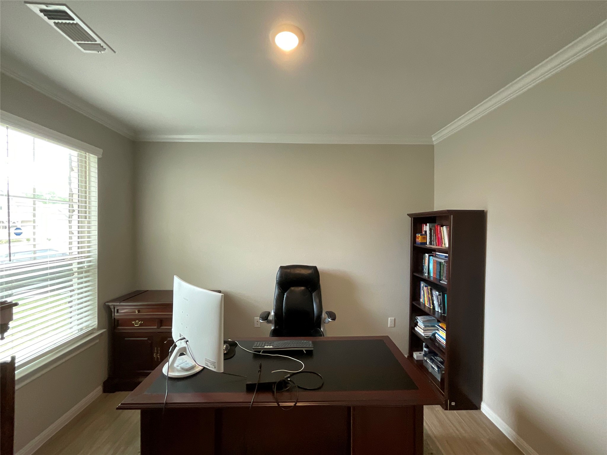5425 Durango Pass Austin, TX 78724 - Photo 7 of 32 Home office featuring crown molding and light wood-style floors