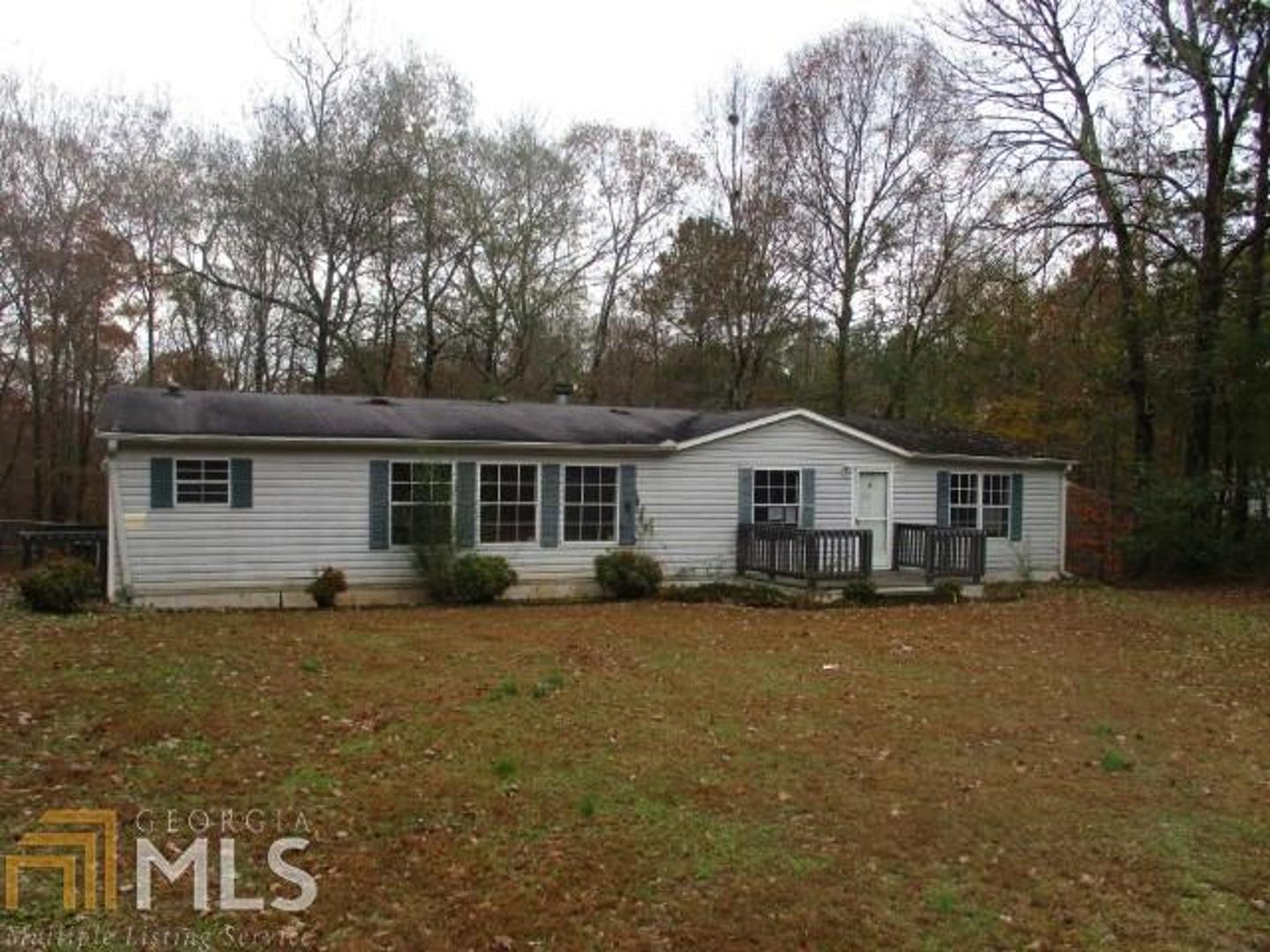 a house with trees in the background