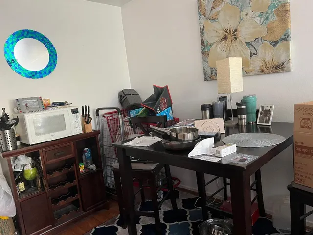 a view of a dining room with furniture and chandelier