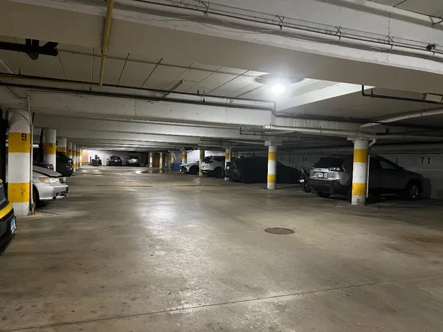 a view of a garage with cars