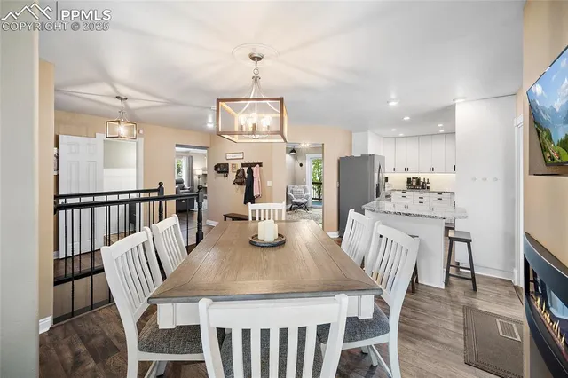 a view of a dining room with furniture window and wooden floor