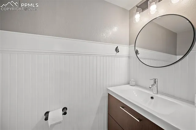 a spacious bedroom with a large bed and a fireplace