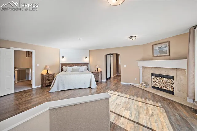a bathroom with a granite countertop shower a sink and a mirror