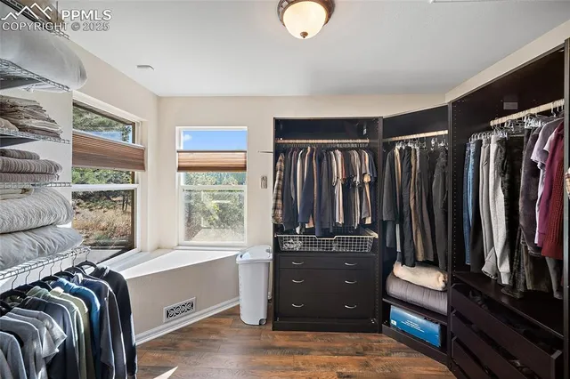 a bathroom with a double vanity sink a mirror and a shower