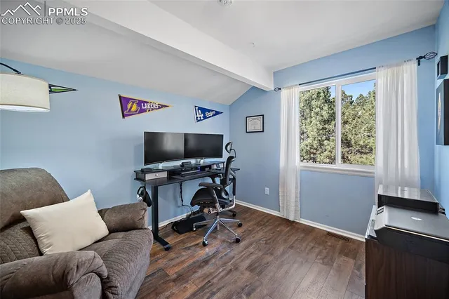 a bedroom with a bed and a book shelf