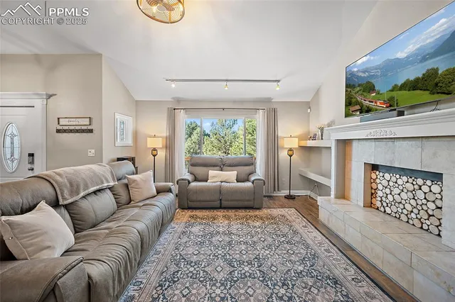 a living room with furniture and a flat screen tv