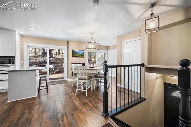 a kitchen with stainless steel appliances granite countertop a stove and cabinets