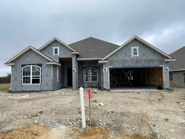 a front view of a house with yard