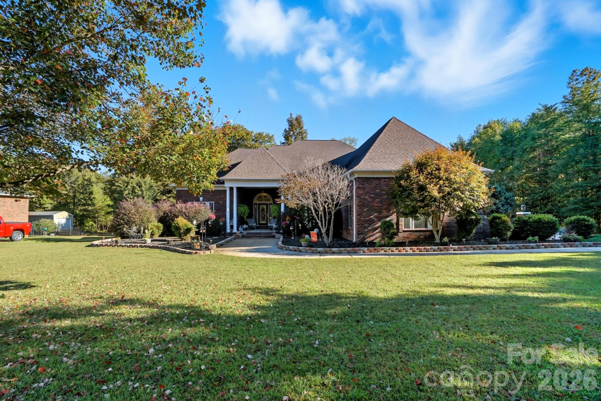 8629 Hayden Way Concord, NC 28025 - Photo 1 of 39 a view of a house with swimming pool and a yard