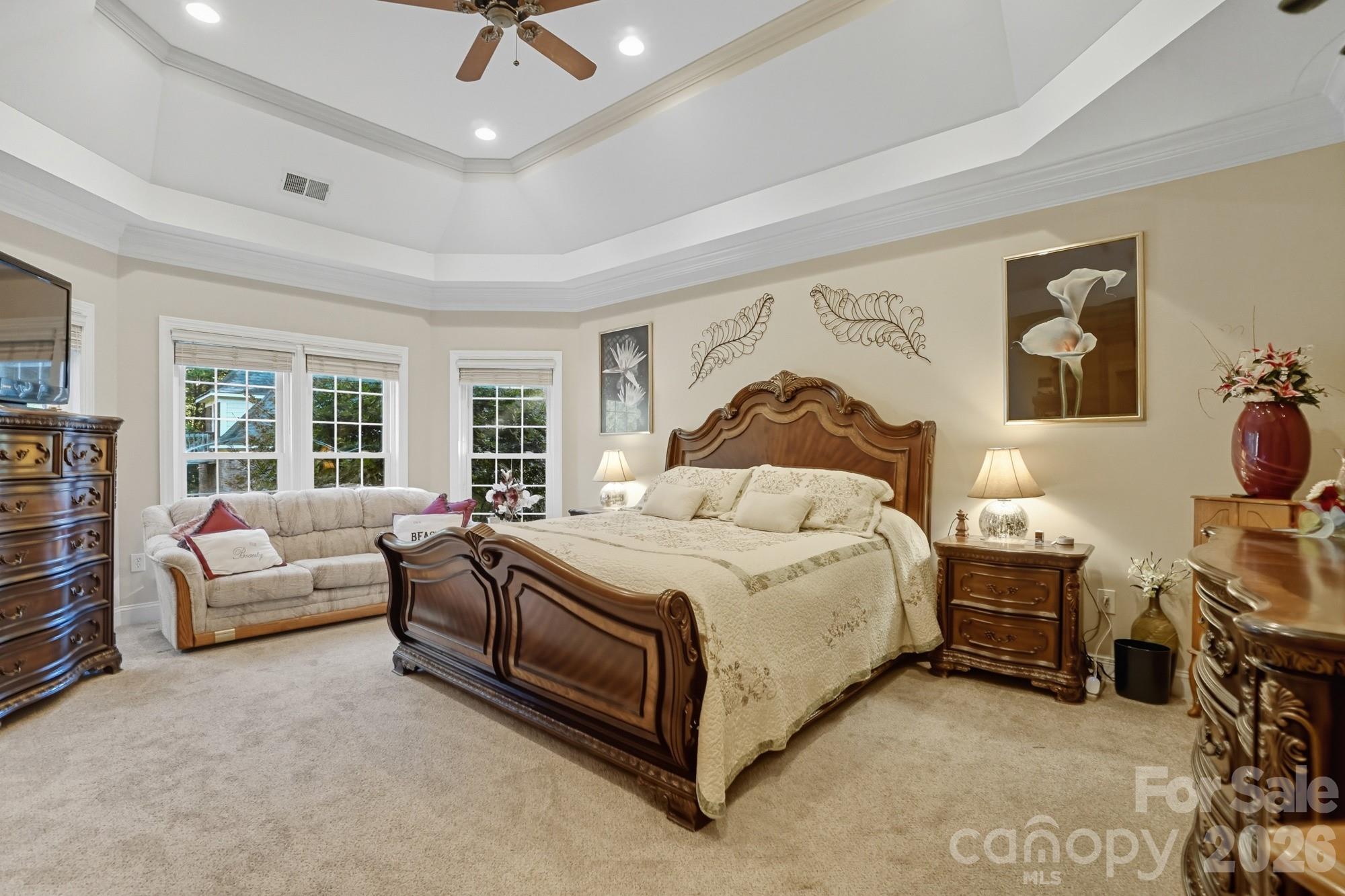 8629 Hayden Way Concord, NC 28025 - Photo 19 of 39 a bedroom with a bed couch and a window