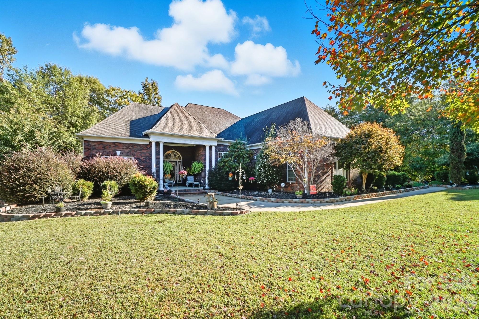 8629 Hayden Way Concord, NC 28025 - Photo 2 of 39 a front view of house with yard and green space