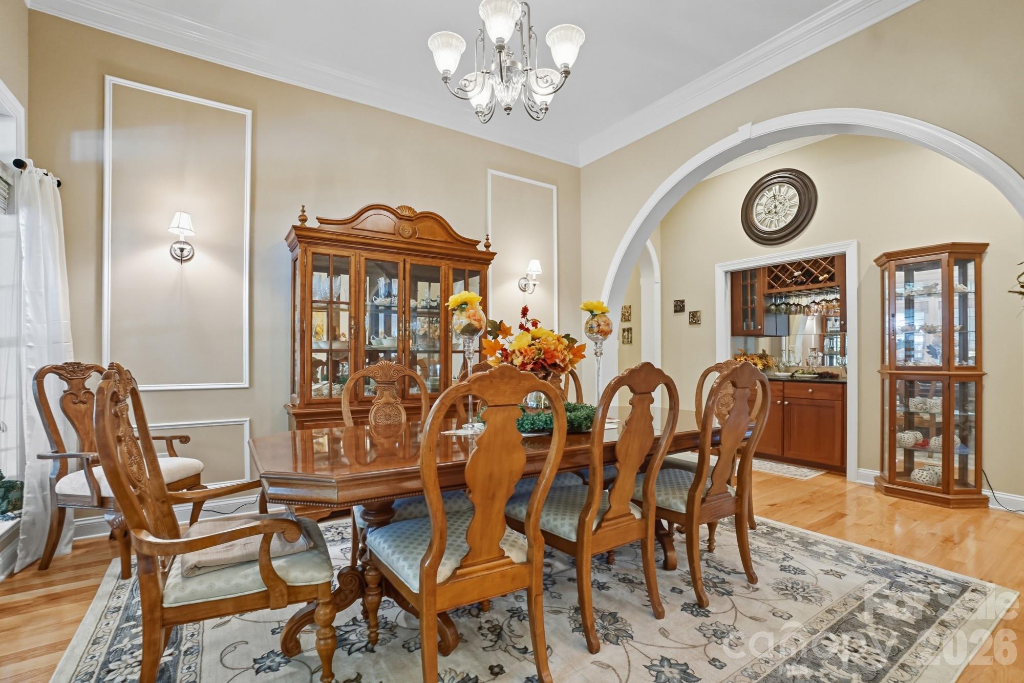 8629 Hayden Way Concord, NC 28025 - Photo 7 of 39 a view of a dining room with furniture and chandelier