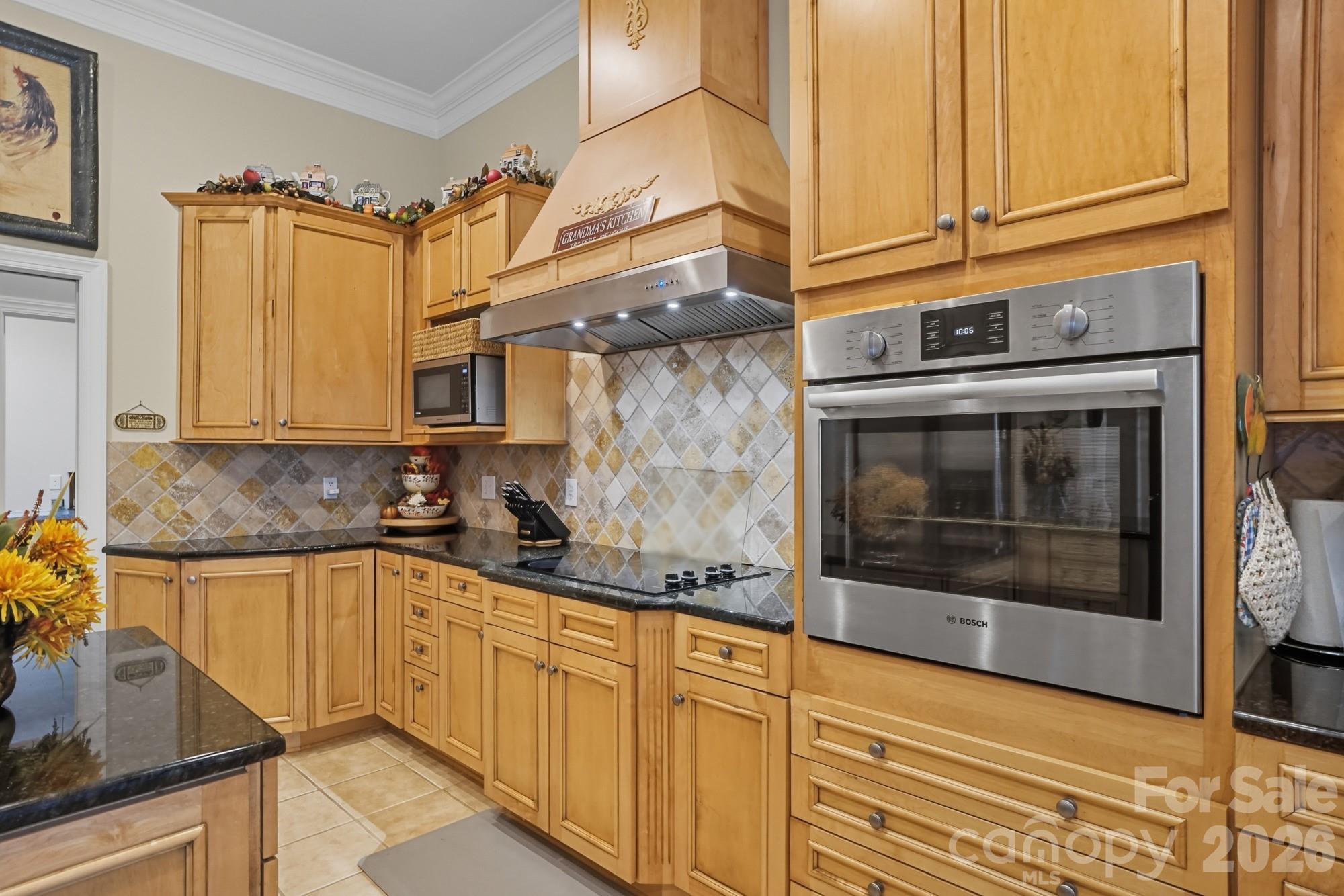 8629 Hayden Way Concord, NC 28025 - Photo 10 of 39 a kitchen with stainless steel appliances granite countertop a sink and cabinets