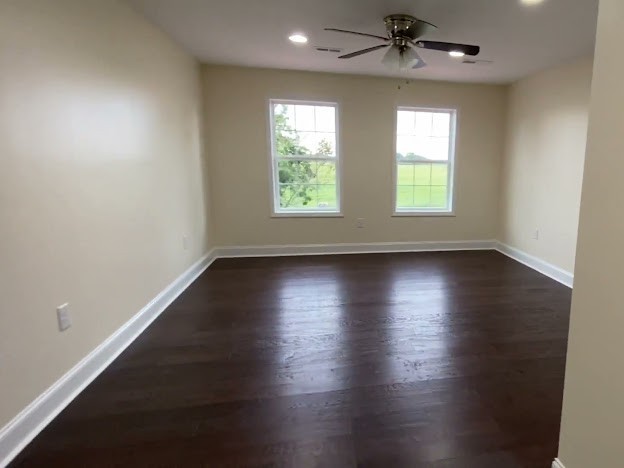 1124 Rabbit Trail Road Five Points, TN 38457 - Photo 5 of 18 an empty room with wooden floor and windows