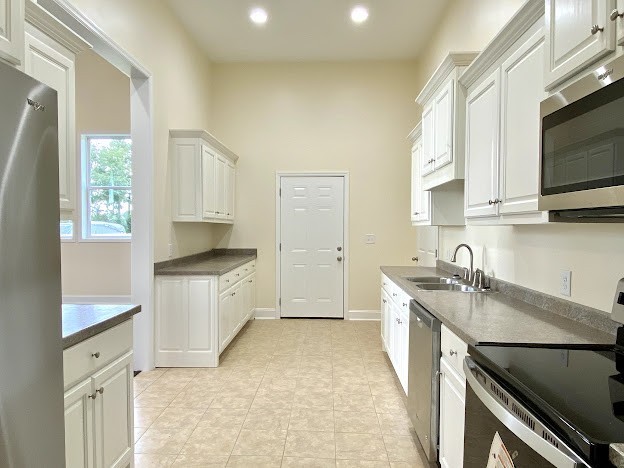 1124 Rabbit Trail Road Five Points, TN 38457 - Photo 10 of 18 a kitchen with a sink stove and microwave