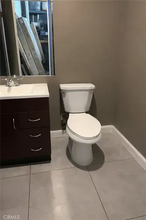 a bathroom with a toilet and a sink