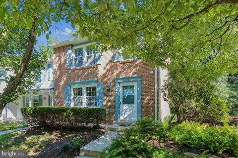 front view of a house with a garden