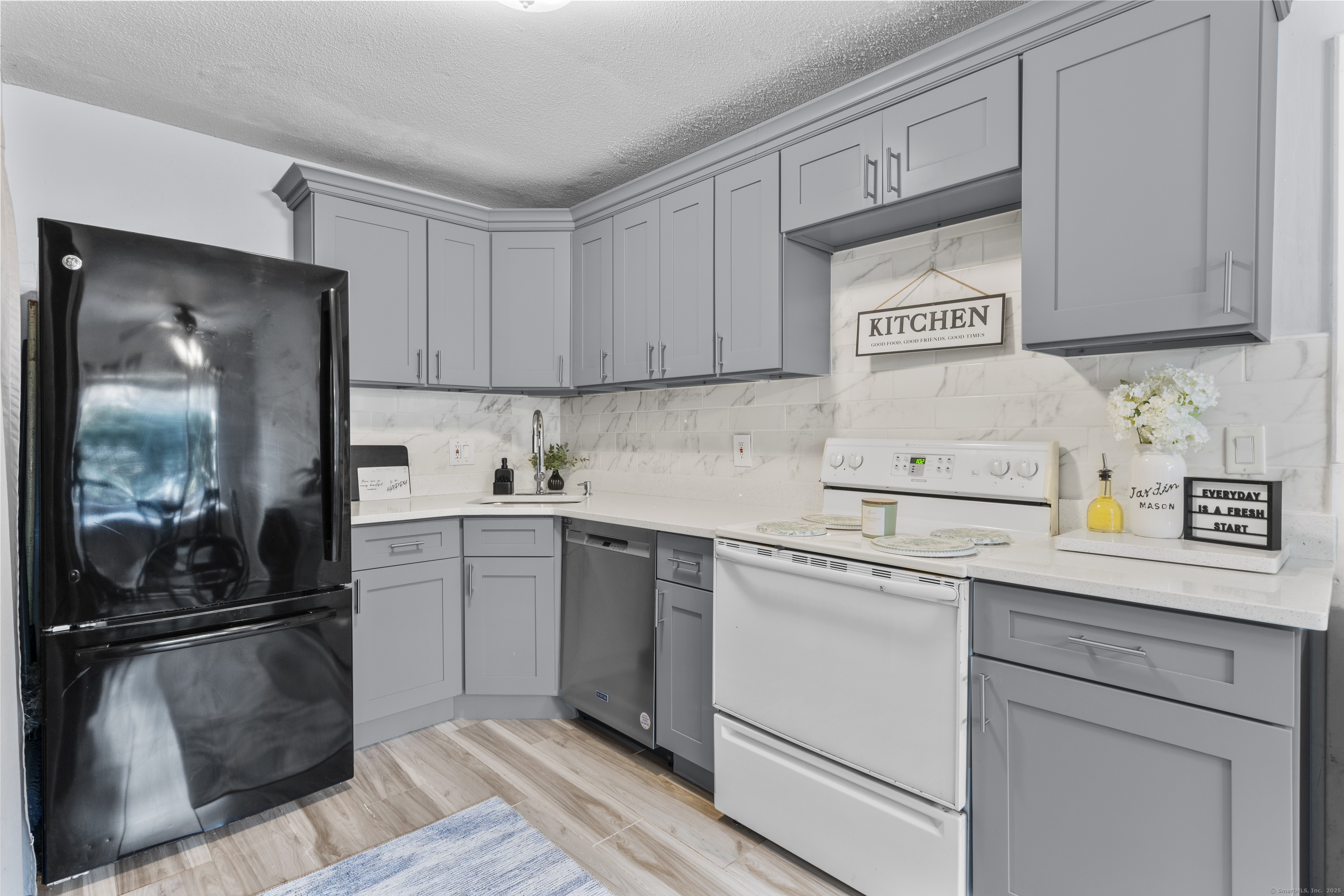 203 Kaynor Drive, Unit B Waterbury, CT 06708 - Photo 11 of 36 a kitchen with cabinets and stainless steel appliances