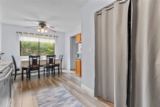 a dining room with furniture window wooden floor