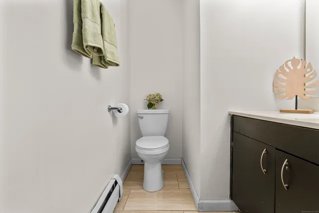 a bathroom with a toilet and a sink