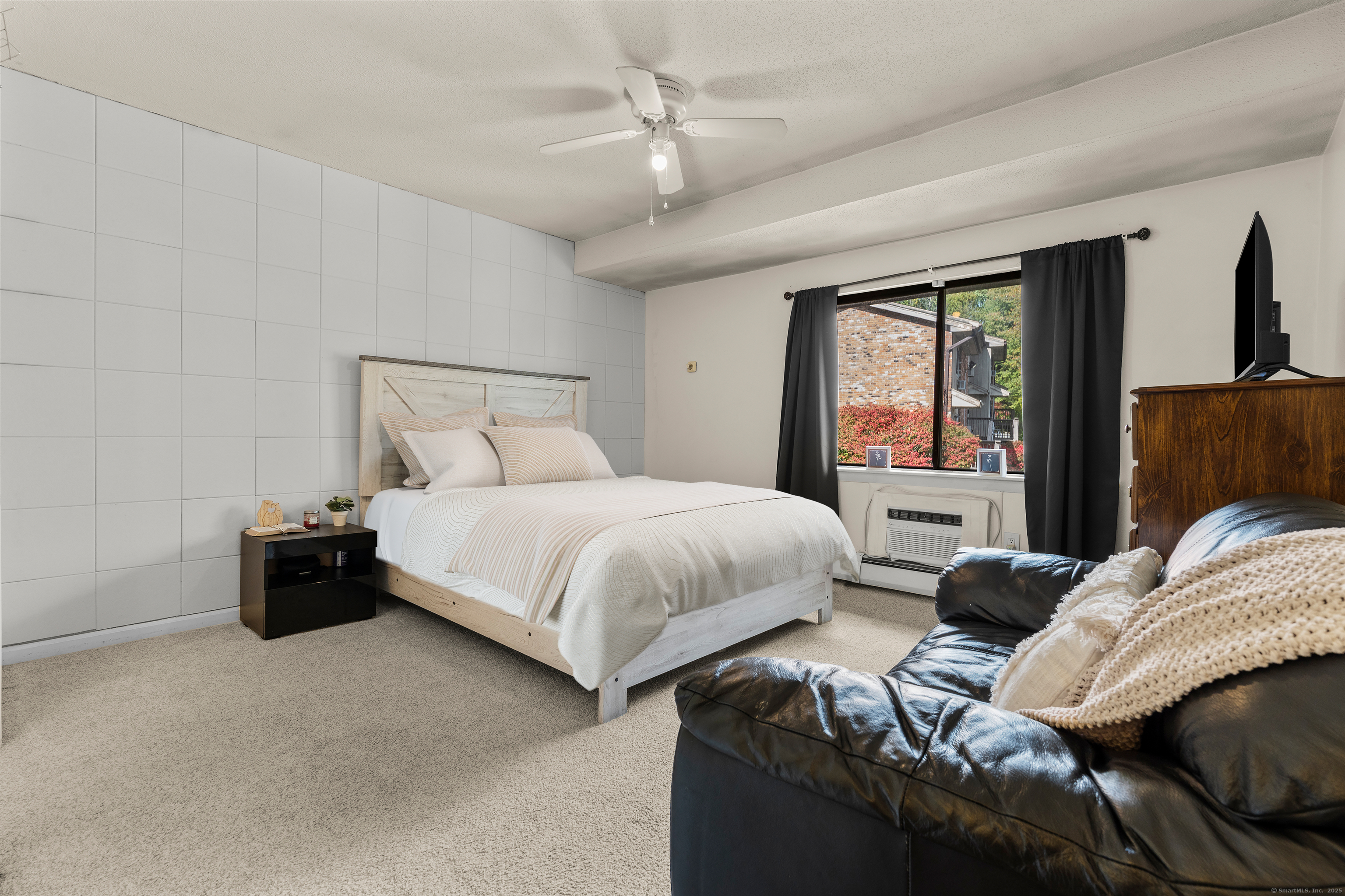 203 Kaynor Drive, Unit B Waterbury, CT 06708 - Photo 17 of 36 a bedroom with a bed and wooden floor