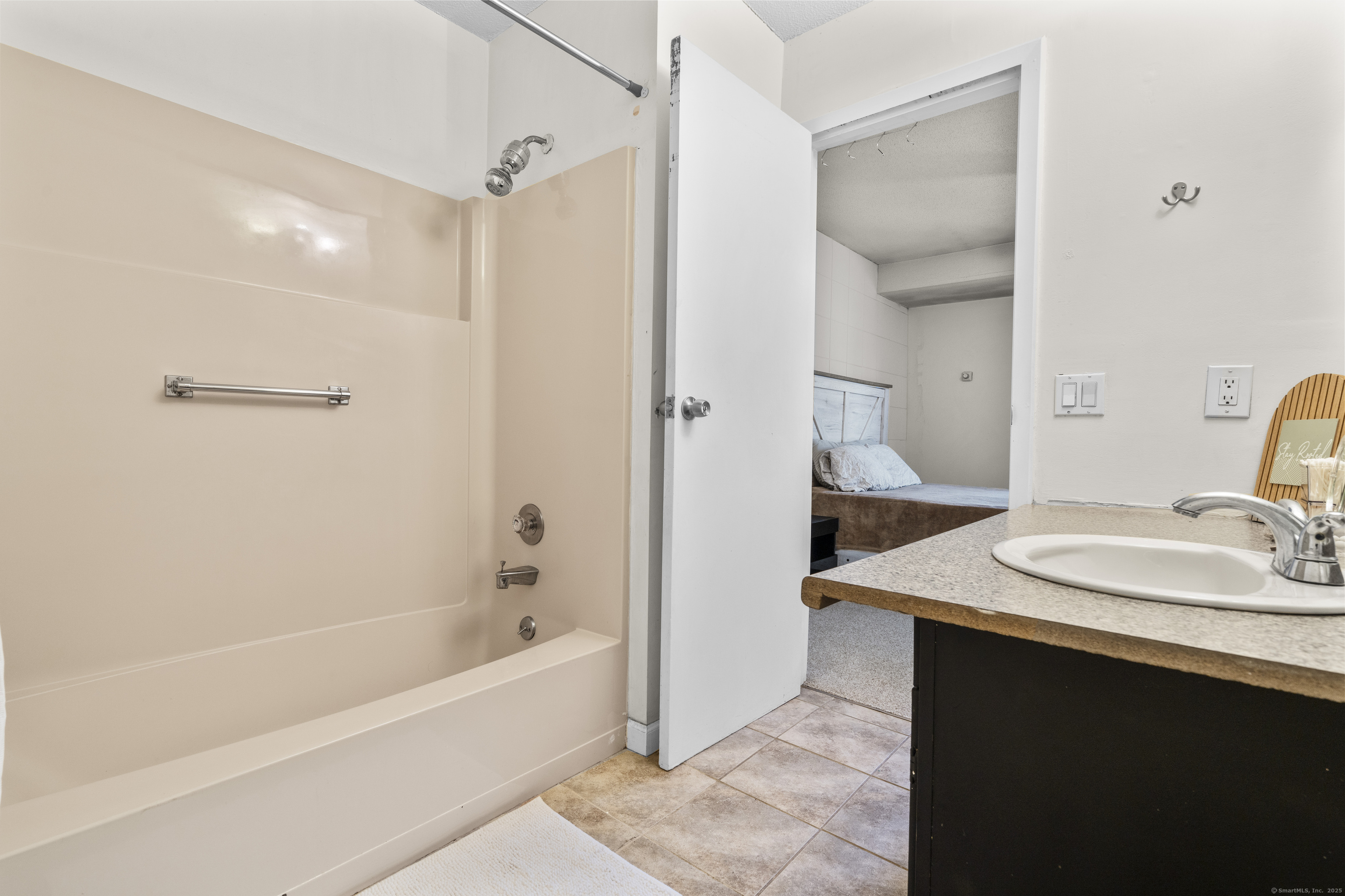 203 Kaynor Drive, Unit B Waterbury, CT 06708 - Photo 23 of 36 a bathroom with a sink and a mirror