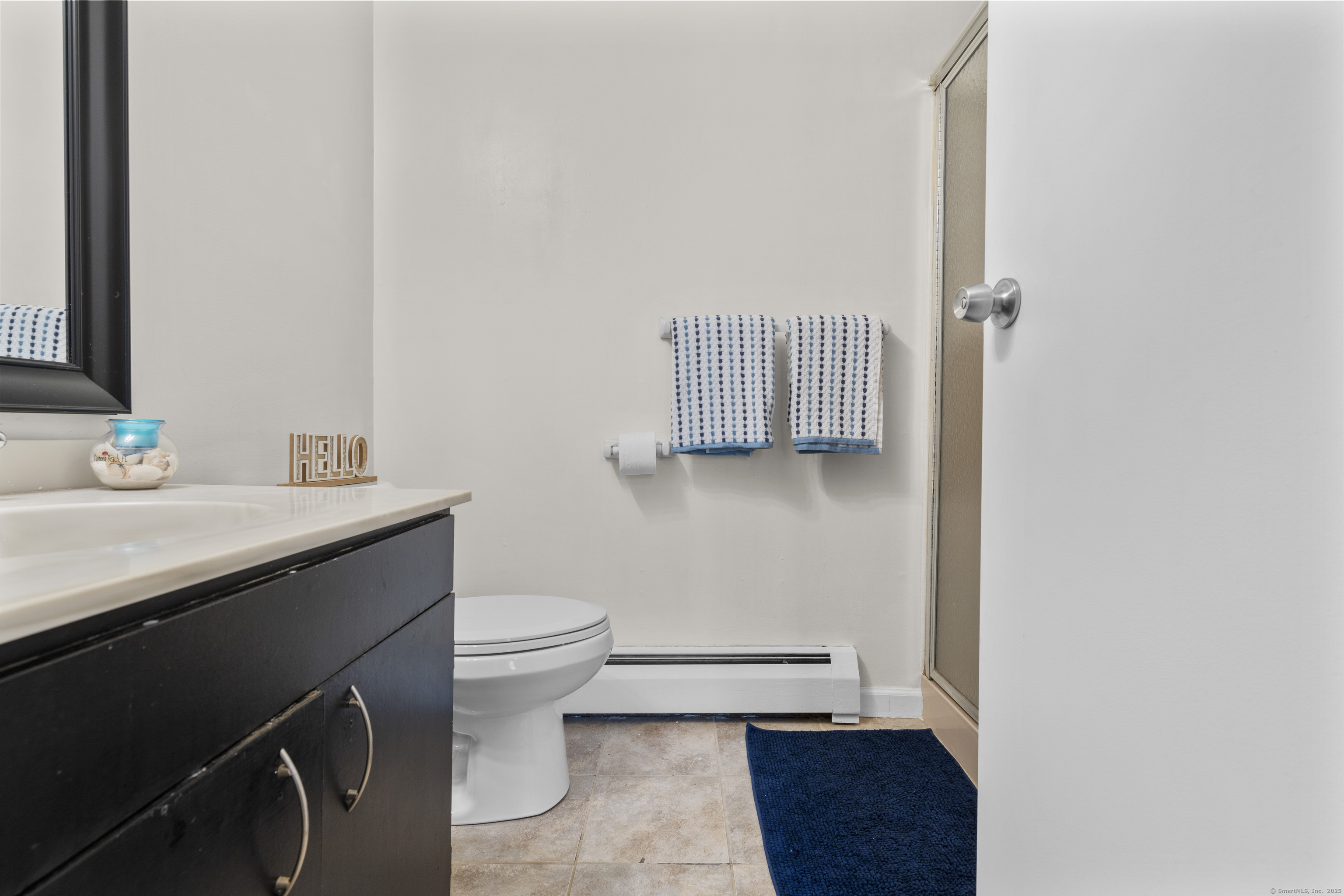 203 Kaynor Drive, Unit B Waterbury, CT 06708 - Photo 26 of 36 a bathroom with a sink toilet and vanity