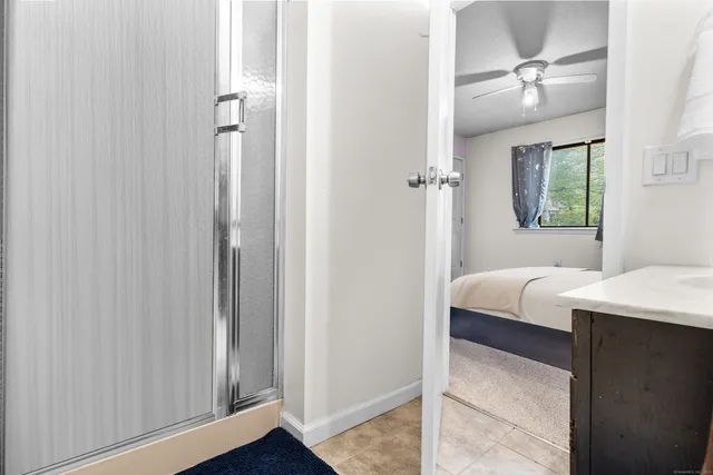 a bathroom with a bathtub and a shower