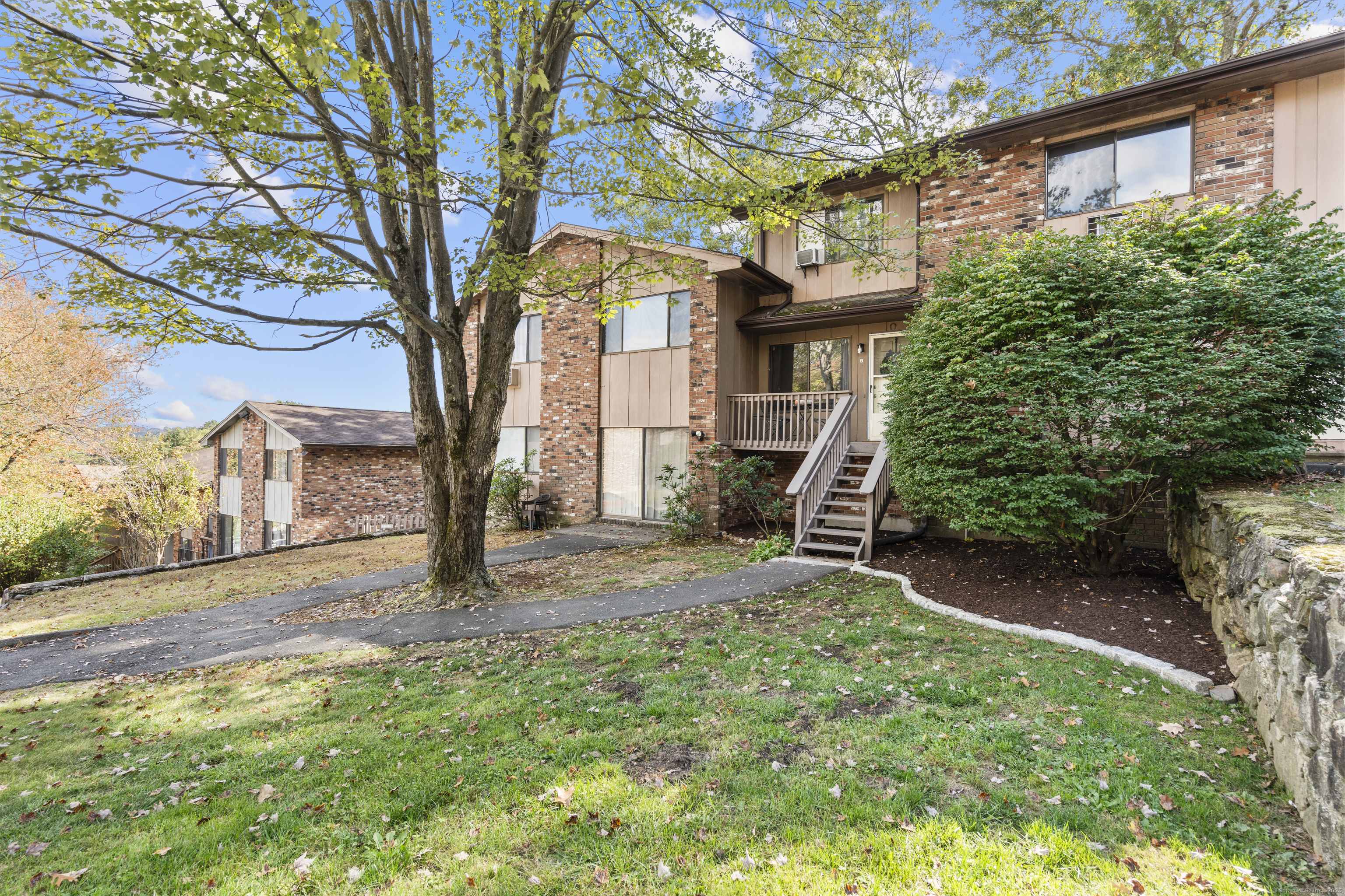 203 Kaynor Drive, Unit B Waterbury, CT 06708 - Photo 28 of 36 a view of a house with a yard