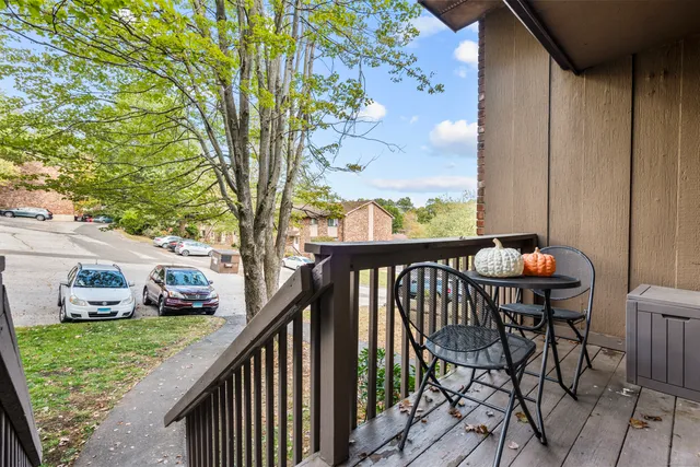 a view of a balcony with chairs