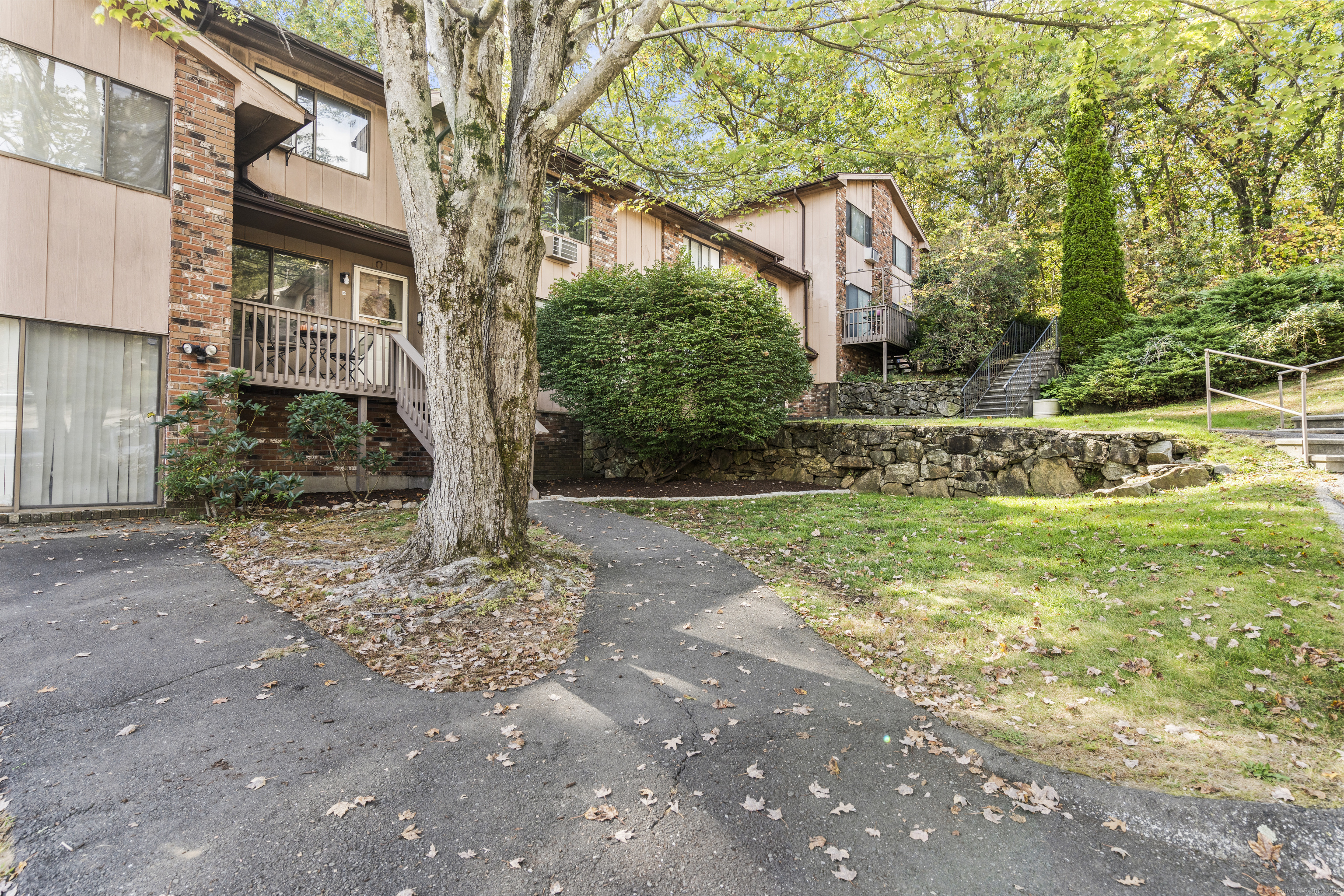 203 Kaynor Drive, Unit B Waterbury, CT 06708 - Photo 31 of 36 a front view of a house with garden