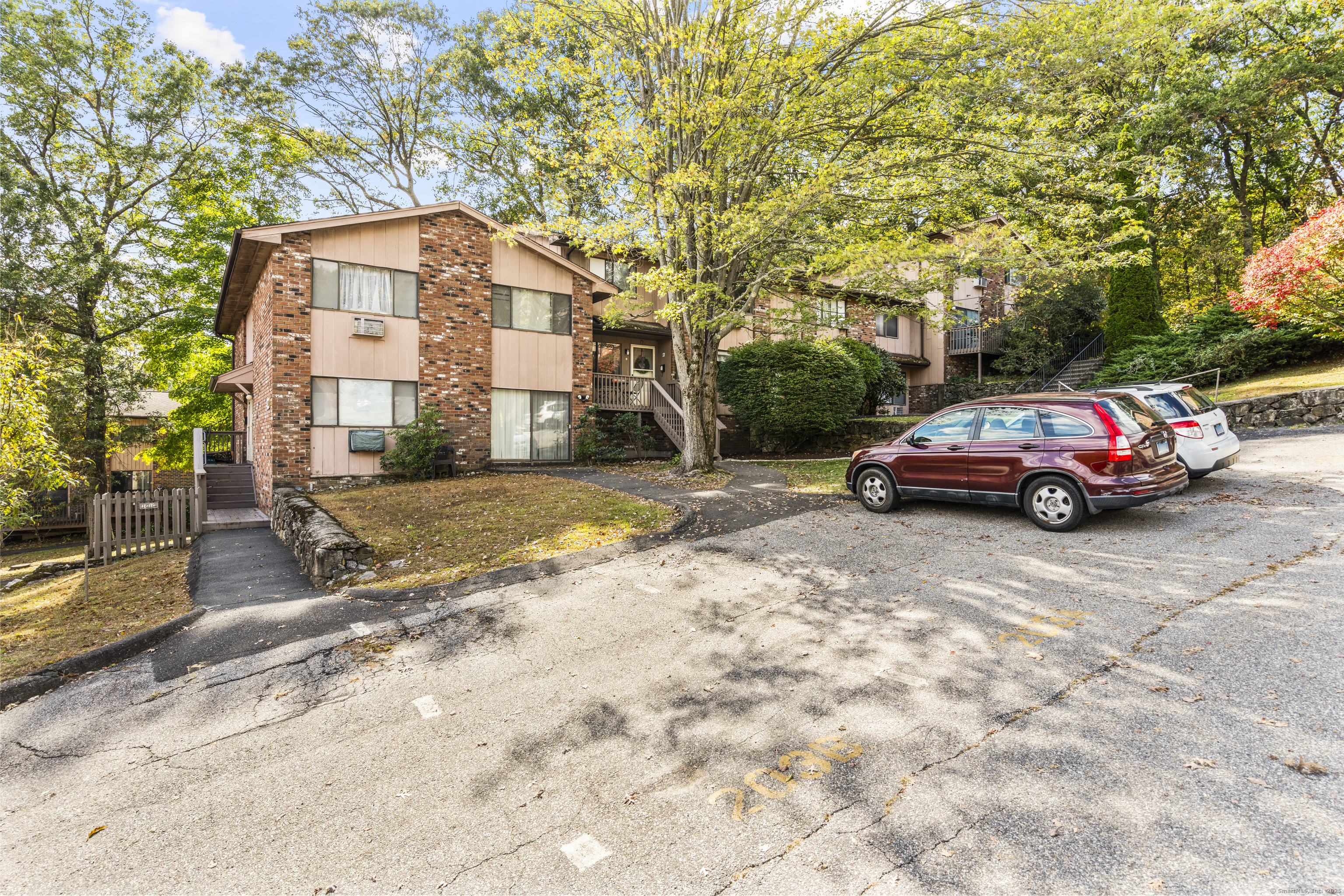 203 Kaynor Drive, Unit B Waterbury, CT 06708 - Photo 32 of 36 a front view of a house with a yard