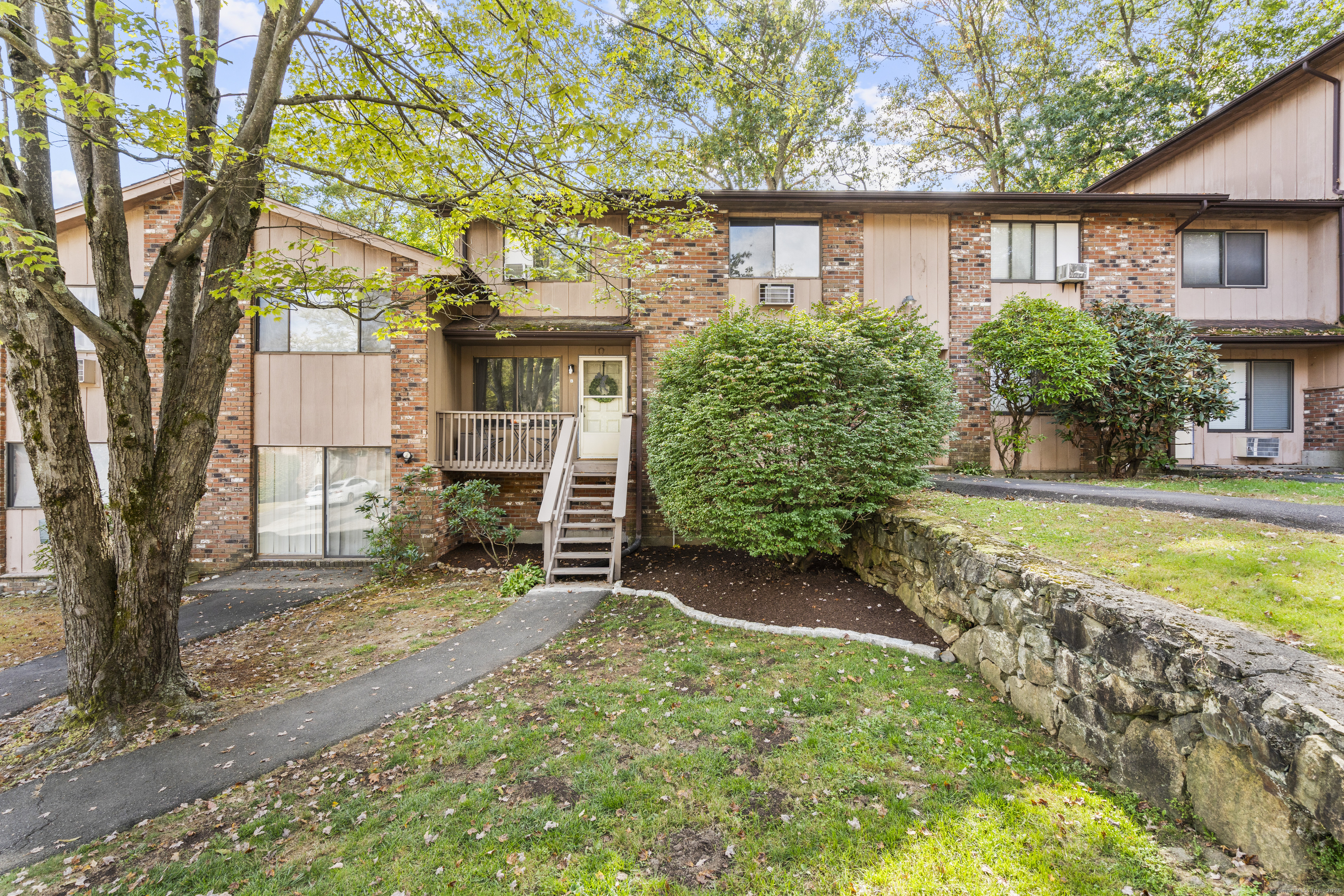 203 Kaynor Drive, Unit B Waterbury, CT 06708 - Photo 35 of 36 a view of a house with a yard