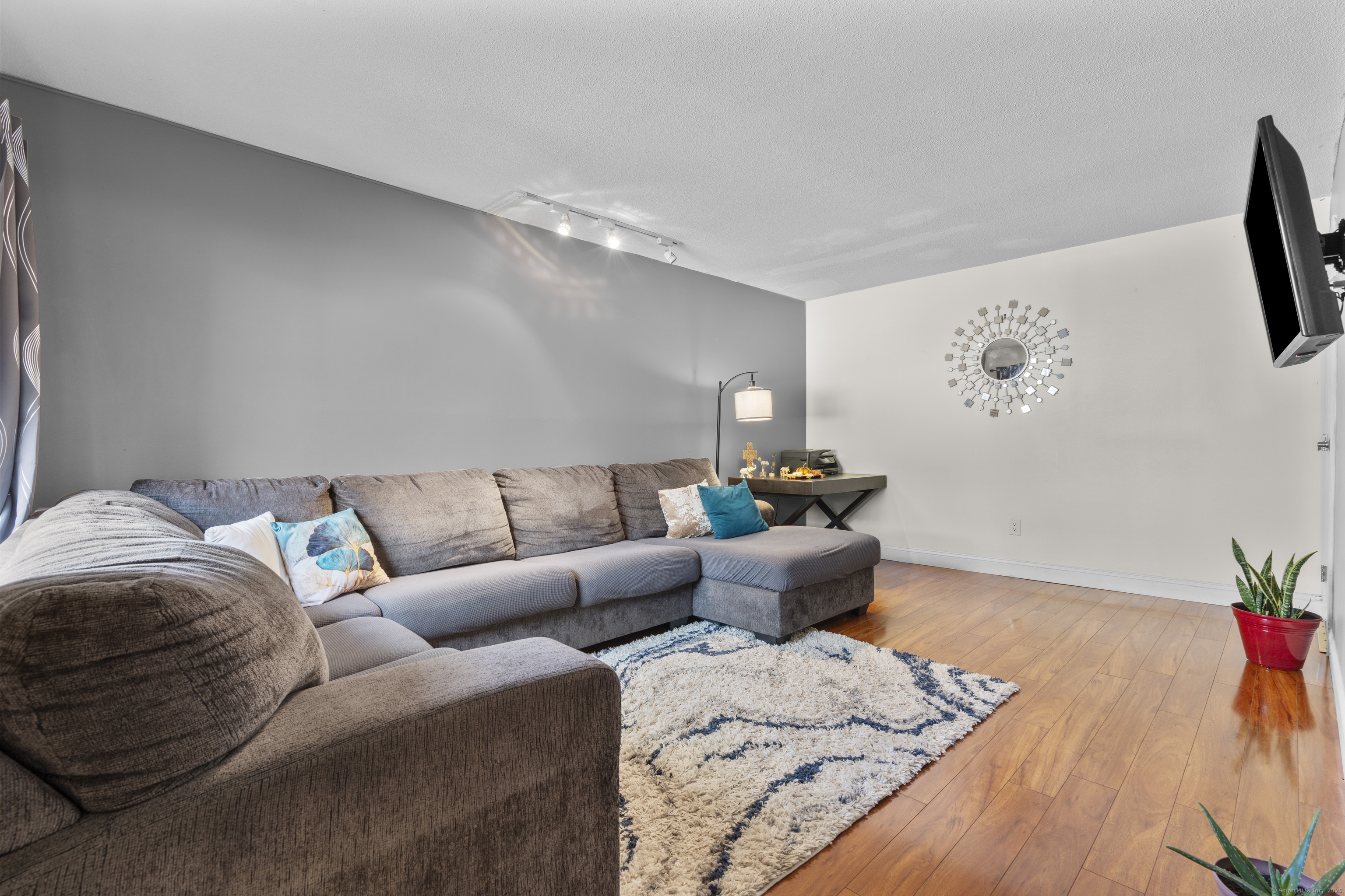 203 Kaynor Drive, Unit B Waterbury, CT 06708 - Photo 5 of 36 a living room with furniture and wooden floor