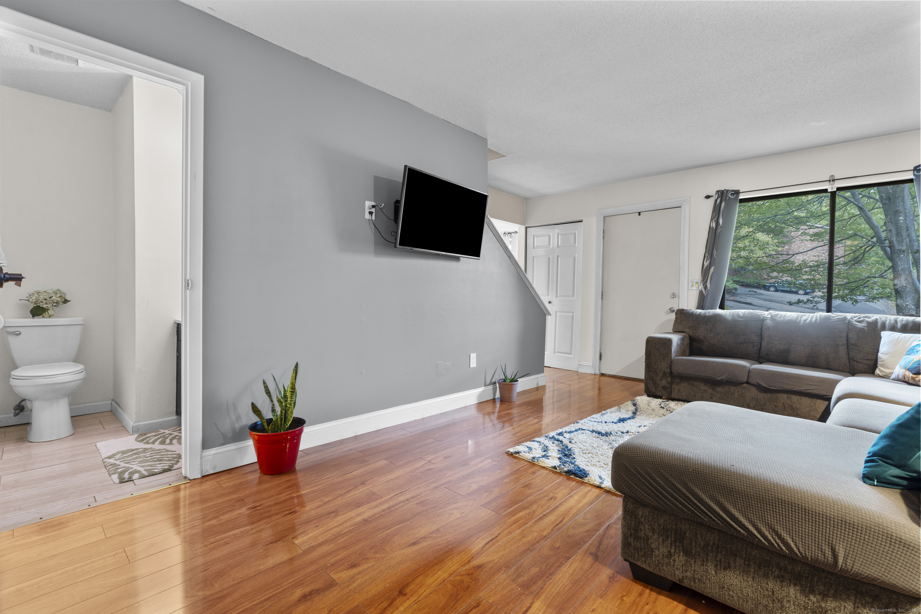 203 Kaynor Drive, Unit B Waterbury, CT 06708 - Photo 6 of 36 a living room with furniture and a flat screen tv