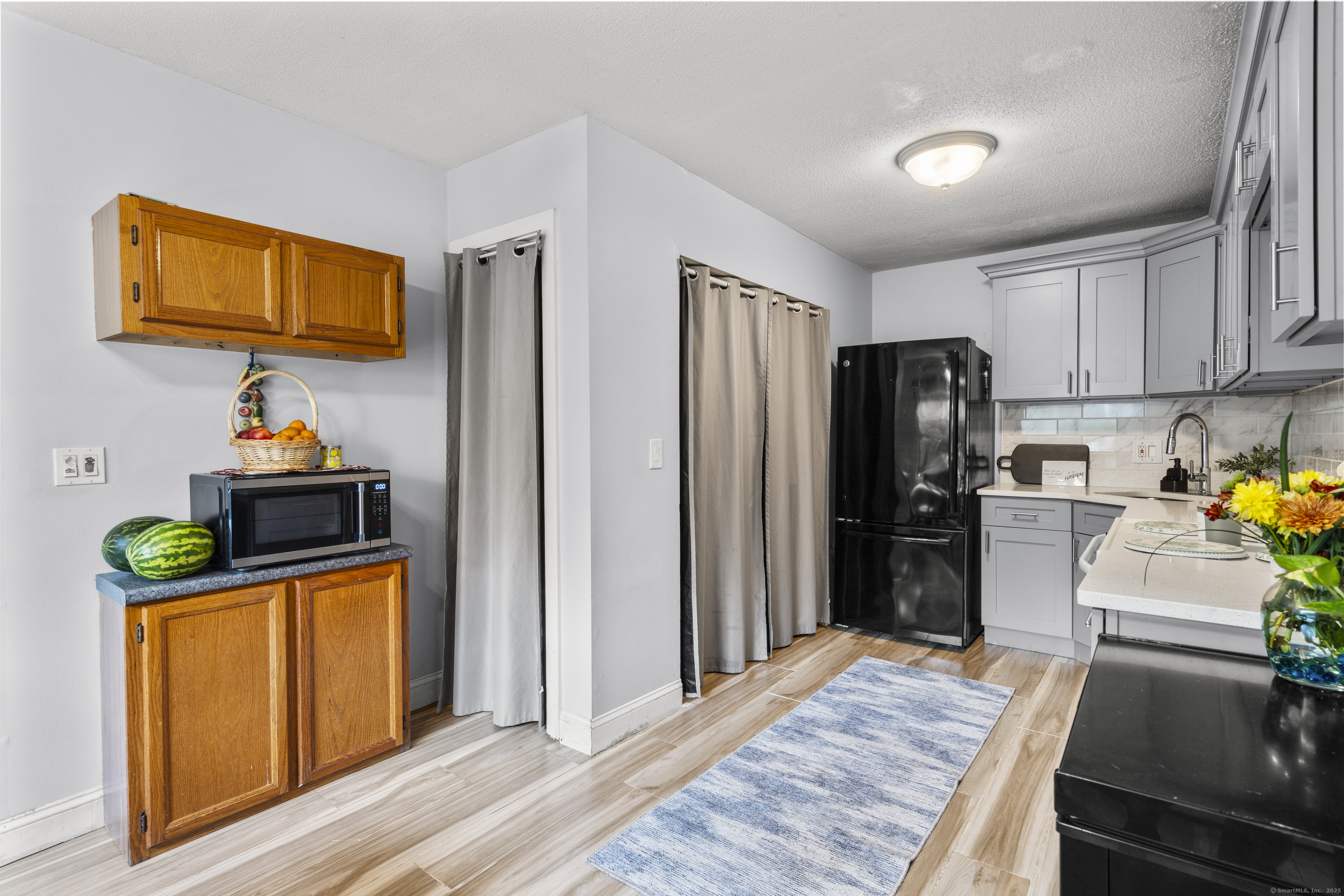 203 Kaynor Drive, Unit B Waterbury, CT 06708 - Photo 8 of 36 a kitchen with stainless steel appliances granite countertop a refrigerator a stove and a wooden floors