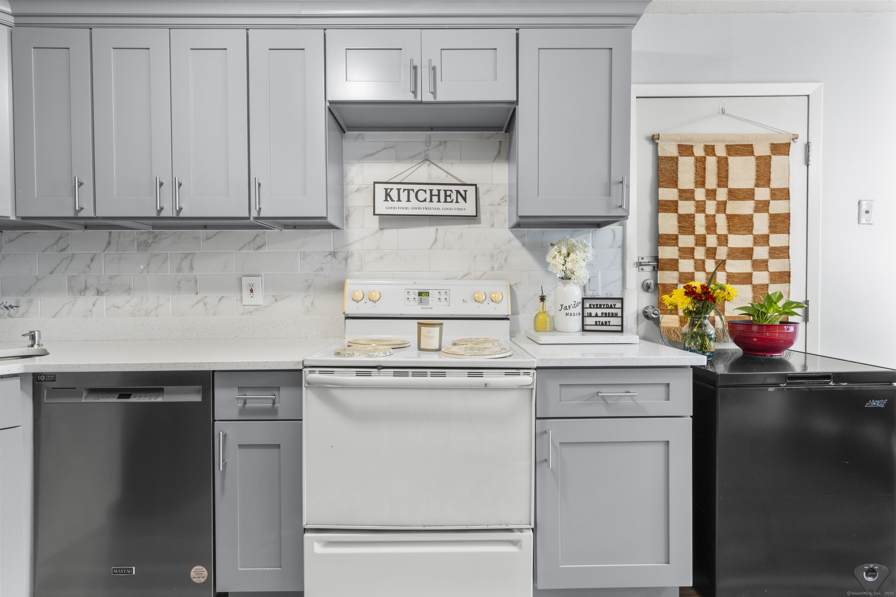 203 Kaynor Drive, Unit B Waterbury, CT 06708 - Photo 9 of 36 a kitchen with stainless steel appliances granite countertop a sink stove and cabinets