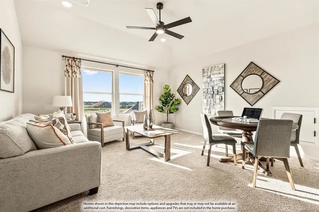 a living room with furniture a rug and a large window