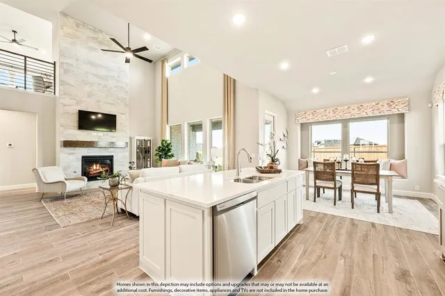 a large white kitchen with a large window