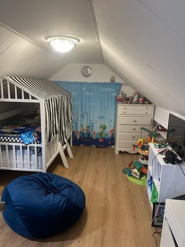 a view of a livingroom with workspace and a couch