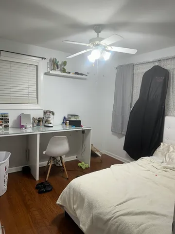 a bedroom with a bed and a chair