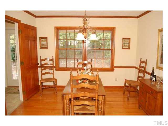 6305 Arnold Road Raleigh, NC 27607 - Photo 6 of 25 a living room with furniture and large windows