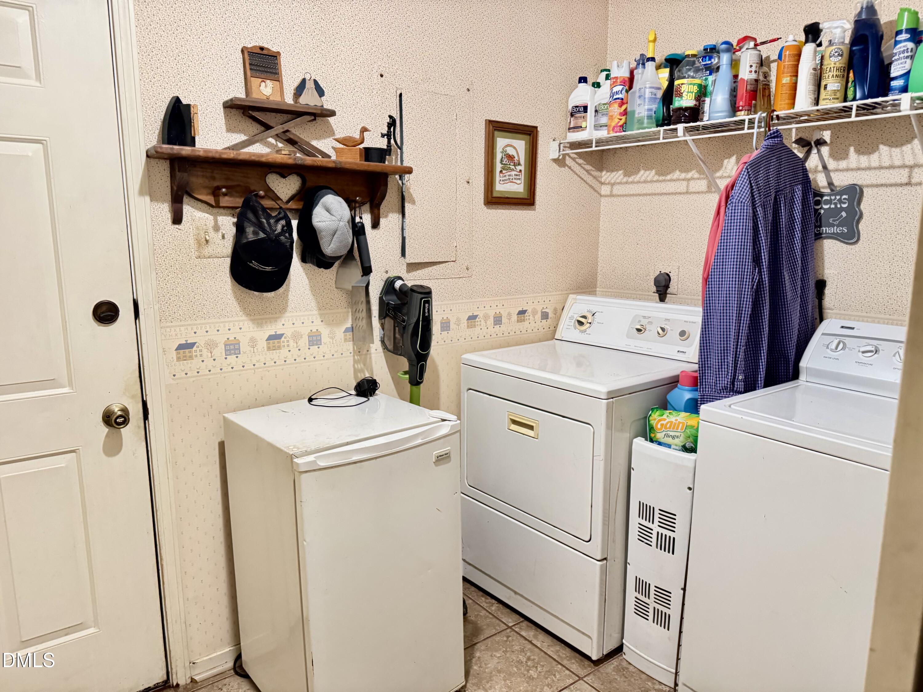 84 Wintergreen Road Henderson, NC 27537 - Photo 38 of 49 a utility room with dryer and washer