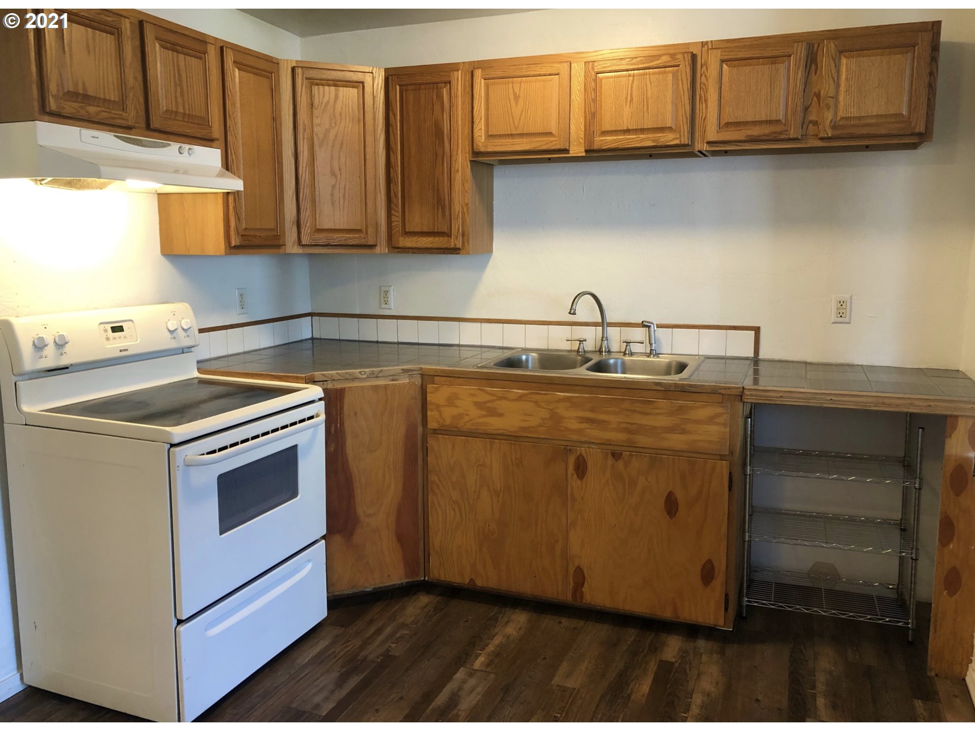 623 Southwest 4th Street Pendleton, OR 97801 - Photo 5 of 32 a kitchen with a sink cabinets and appliances